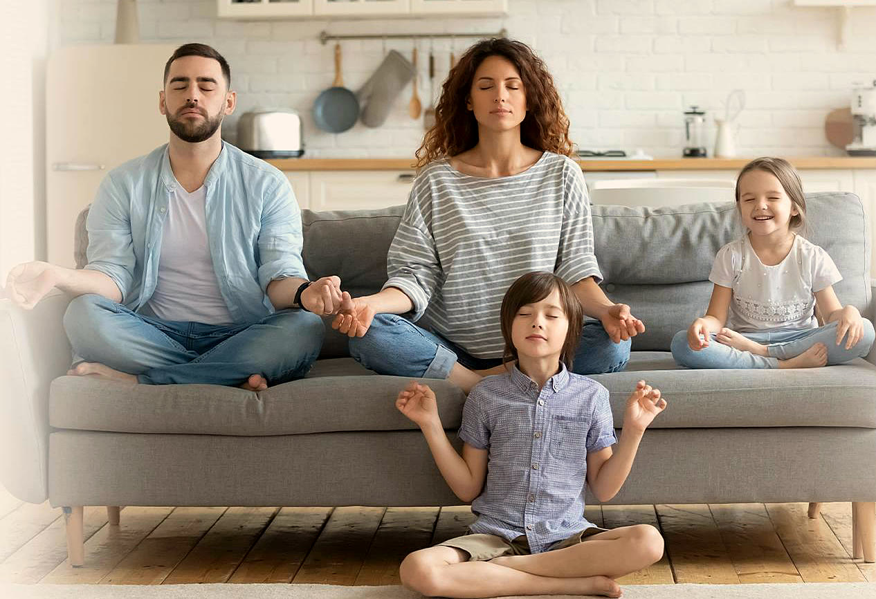 A family relaxing comfortably together on their living room couch