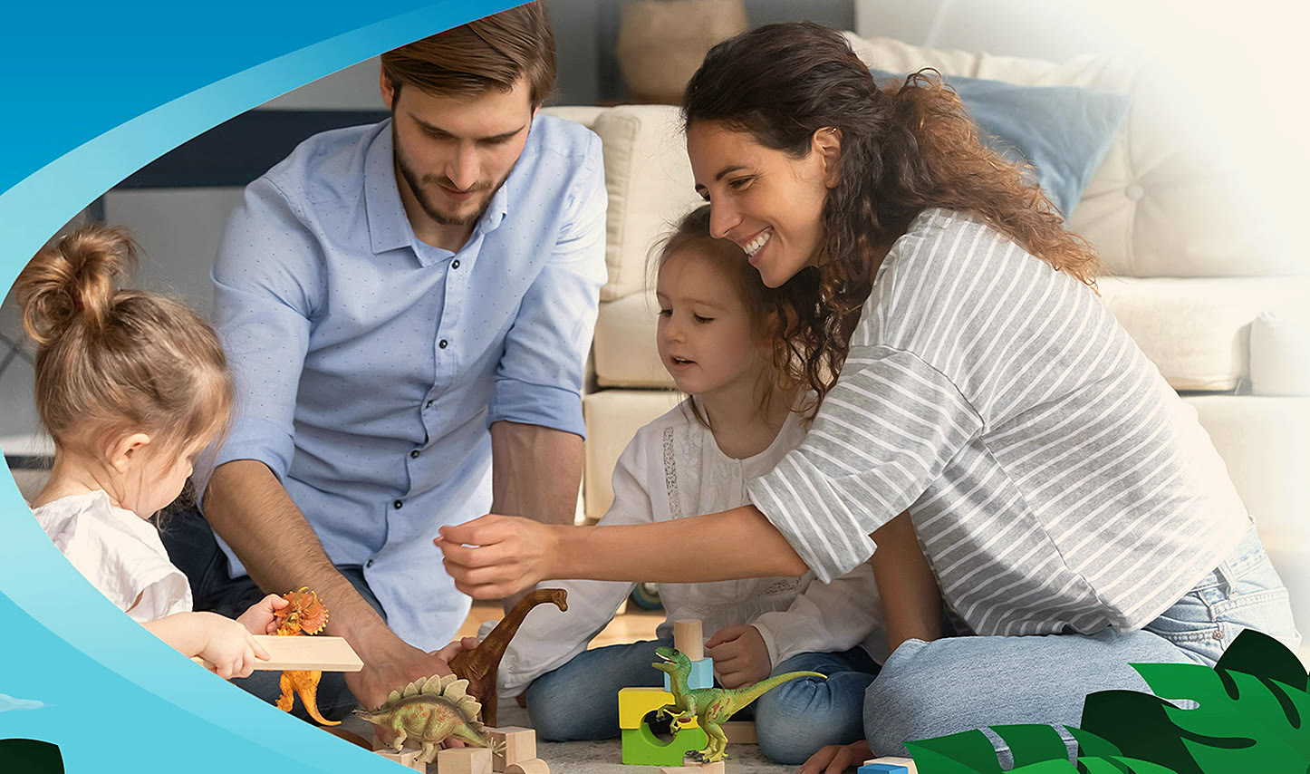 A family playing with dinosaur toys together in their living room