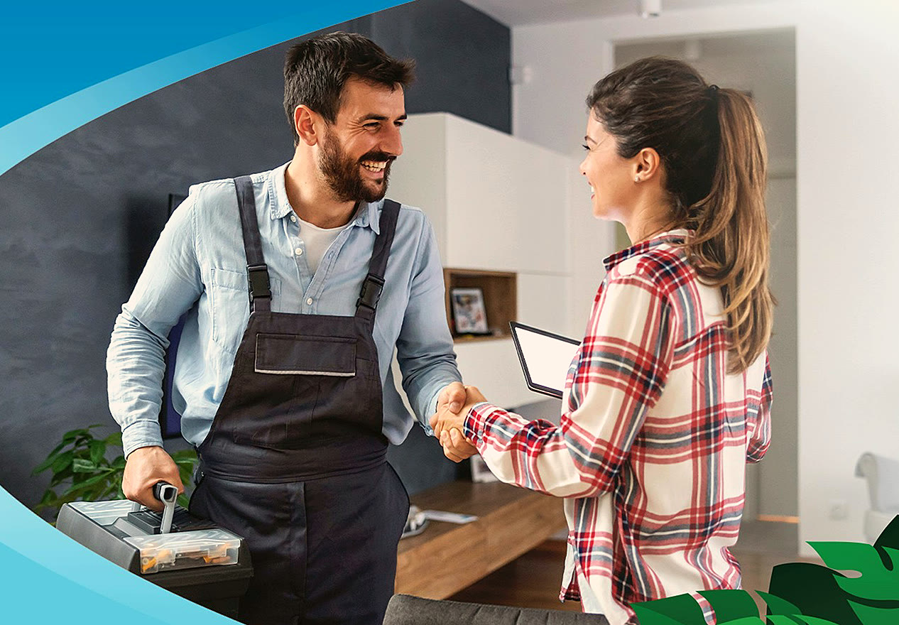 A Dinomite technician shaking hands with a happy customer in her home